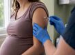 Pregnant woman getting Tdap vaccine injection