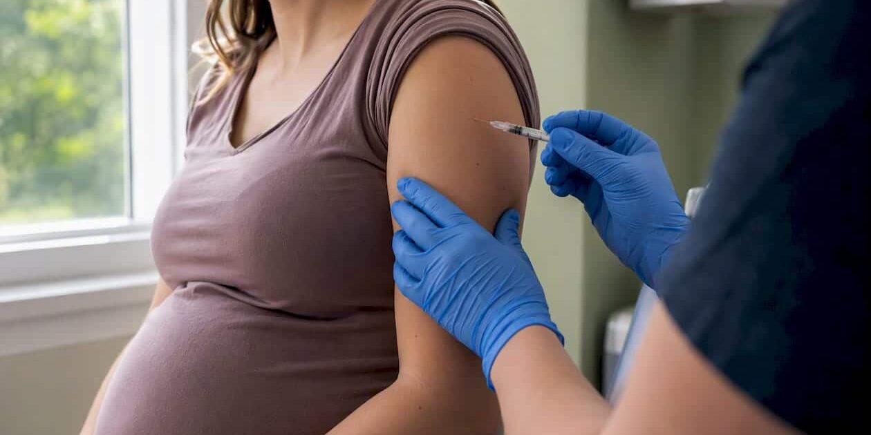 1786482408802_Pregnant-woman-getting-Tdap-vaccine-injection Pregnant woman getting Tdap vaccine injection