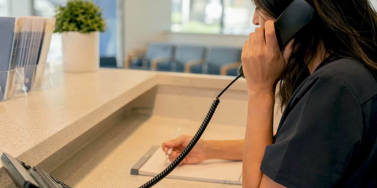 1786649537504_Clinic-staff-making-a-cost-inquiry-call Clinic staff making a cost inquiry call