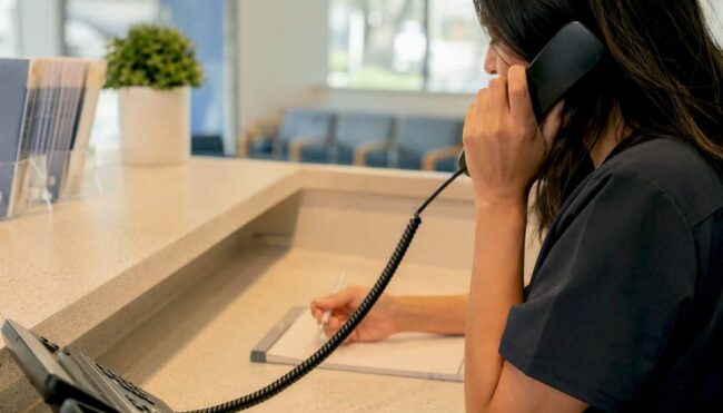 Clinic staff making a cost inquiry call