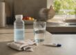 Oral rehydration solution and thermometer on bathroom counter