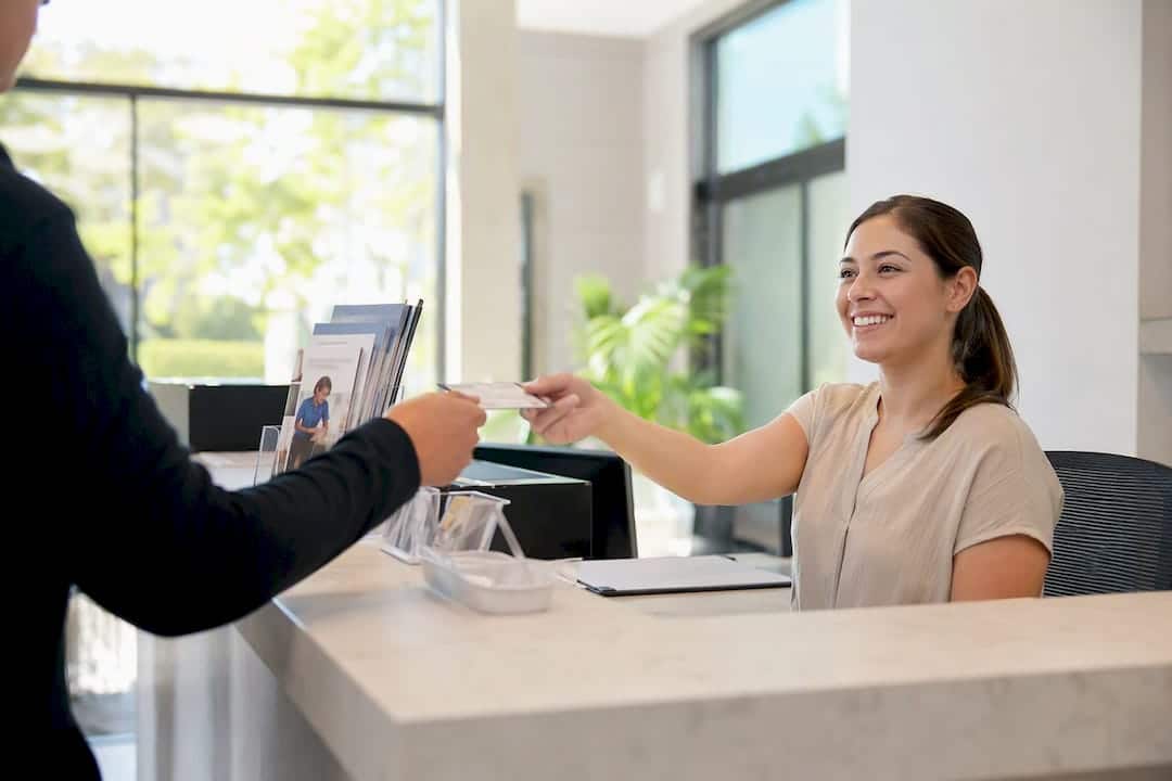 Patient checking in at clinic front desk
