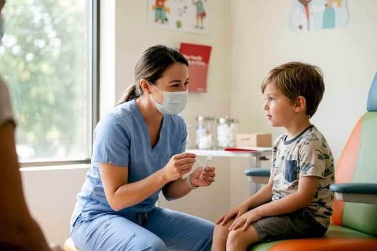Healthcare worker administering nasal swab test in clinic