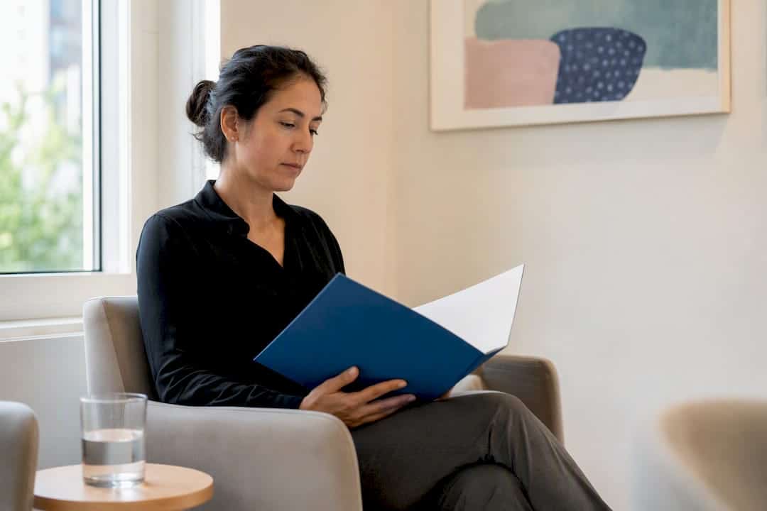 Patient holding blank herpes test report folder
