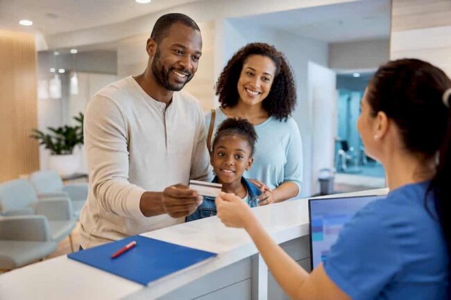 Member checking in at urgent care reception