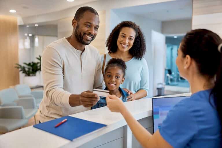 Member checking in at urgent care reception