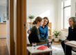 Teen speaking with clinician and caregiver