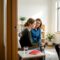 Teen speaking with clinician and caregiver