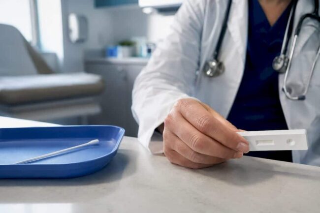 Clinician reviewing rapid flu test result