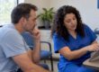 Parent discussing affordable care options at clinic