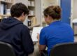 Teen discussing confidential insurance billing at clinic