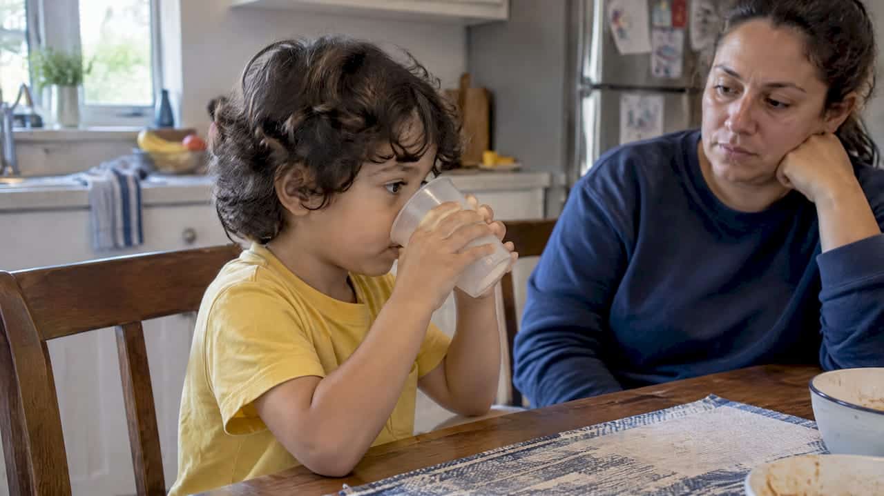 Child drinking water during HFMD home care