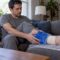 Adult applying a cold pack to an ankle