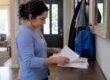 Parent sorting a child’s school vaccine records