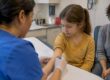 Clinician gives child a TB skin test