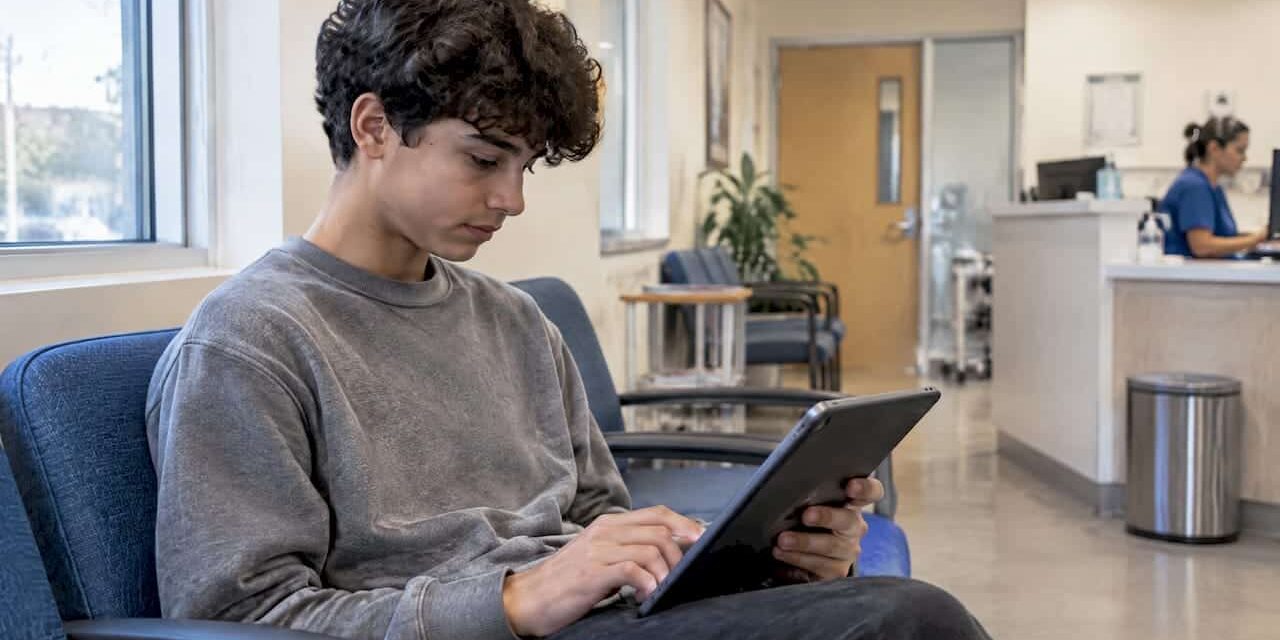 1792053774491_Teen-completing-a-depression-screening-questionnaire Teen completing a depression screening questionnaire