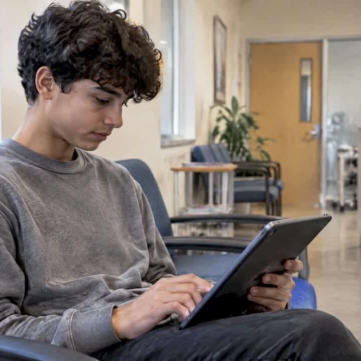 Teen completing a depression screening questionnaire