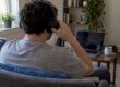 Patient adjusting headphones before online therapy