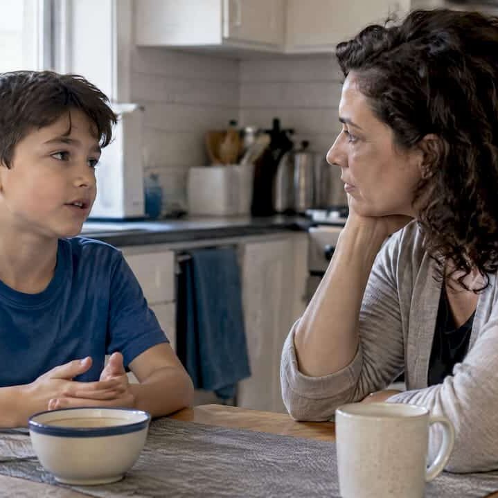 Mother listening as child talks at home