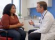 Clinician and patient discussing migraine treatment