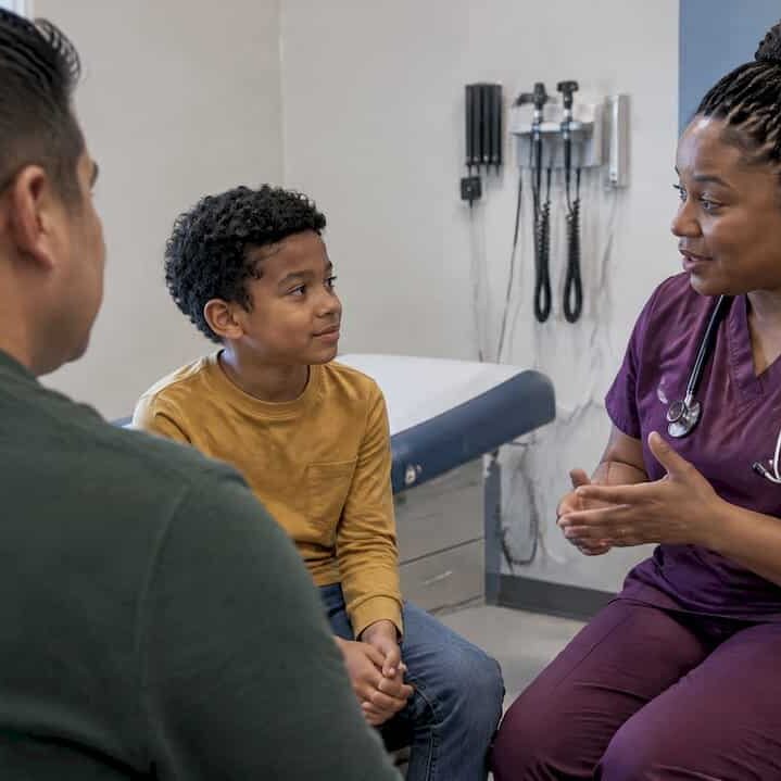 Parent and child discuss HPV vaccine timing